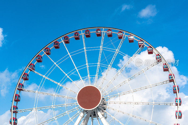 White ferris wheel on a blue pastel sky background